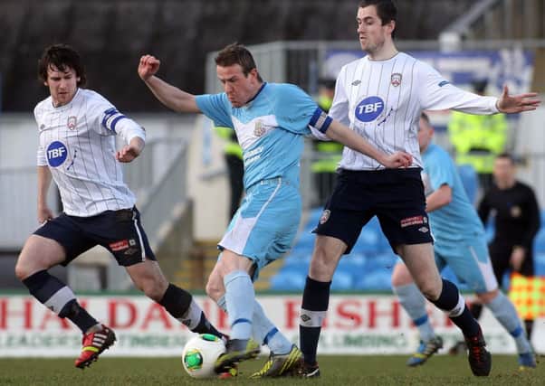 Ballymena captain Allan Jenkins and Coleraine's Howard Beverland and David Ogilby. Picture: Press Eye.