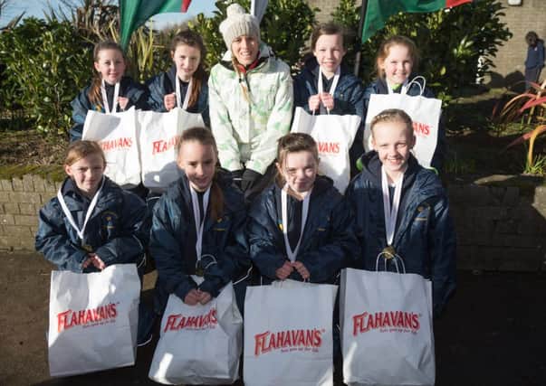 Pictured are the St Thereses girl team along with Londonderry Olympian, Aileen Reid at last weeks NI Primary Schools Cross Country League Finals.
