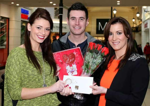 Matthew and Naomi Archer, winners of the Fairhill Centre/Chest, Heart and Stroke Valentines competition, are pictured receiving their prize of an overnight stay in the Galgorm Resort and Spa from Natalie Jackson (Fairhill Centre Marketing and Commercial Manager). INBT08-232AC