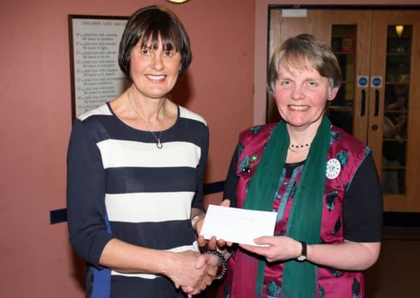 Barbara Totten of Gracehill and Galgorm Womens' Institute is pictured presenting a cheque to Trish Sherry, International Chairman of the Womens' Institute of Ireland, of which she will present to the ACWW. INBT08-258AC