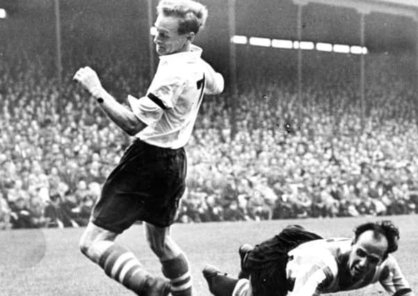 On the turn...Tom Finney in action.