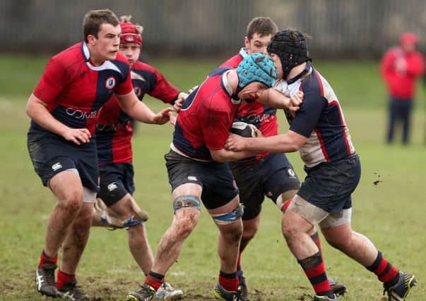 Ballyclare's Jack Magee pushes through the Ballymena Academy defence in the High School's 10-9 Schools' Cup win. Photo: Freddie Parkinson