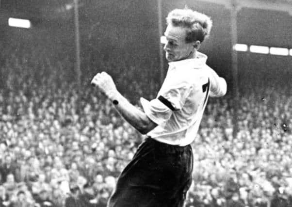 On the turn...Tom Finney in action.