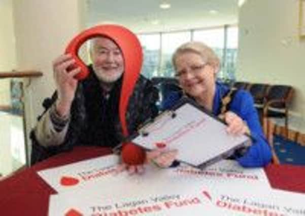 The Mayor of Lisburn, Councillor Margaret Tolerton along with quiz master George McCartney promote the forthcoming Charity Table Quiz taking place at Lagan Valley Island on Thursday February 20.  All proceeds will go to The Lagan Valley Diabetes Fund.