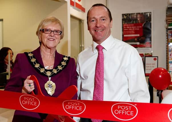 Ballymena Mayor Cllr Audrey Wales MBEand Peter McCool at the opening of the new look Ballee Post Office on Thursday.