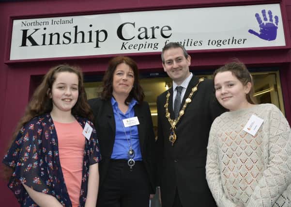 The Mayor, Councillor Martin Reilly, pictured at the opening of Kinship Care, Carlisle Road, with from left, Jessica Ogilvie, Jacqueline Williamson, manager, and Caoimhe Coyle. INLS0814-112KM