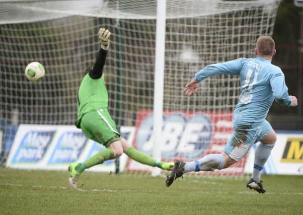 David Cushley slots past Warrenpoint keeper Jonathan Parr to open the scoring for Ballymena United in today's Danske Bank Premiership match at the Showgrounds. Picture: Press Eye.