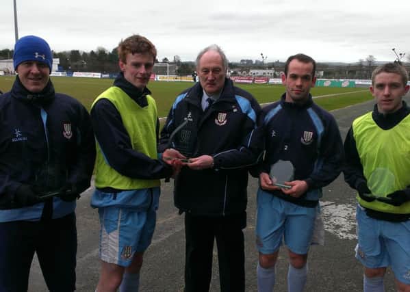 Ballymena United vice-chairman presents Aaron Stewart with a memento marking the defender's 200th appearance for the club recently. Also pictured are Allan Jenkins, Tony Kane and Alan Teggart, who each received awards for reaching 100 appearances in recent weeks.
