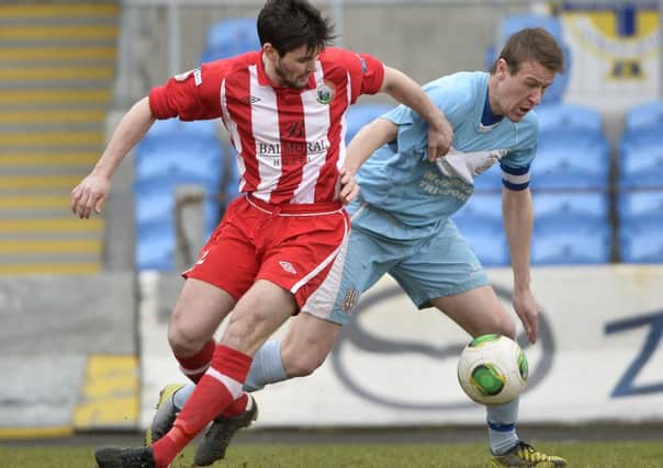 Ballymena United skipper Allan Jenkins in action with Warrenpoint's Darren King
 during Saturday's 3-2 win at the Showgrounds. Picture: Press Eye.