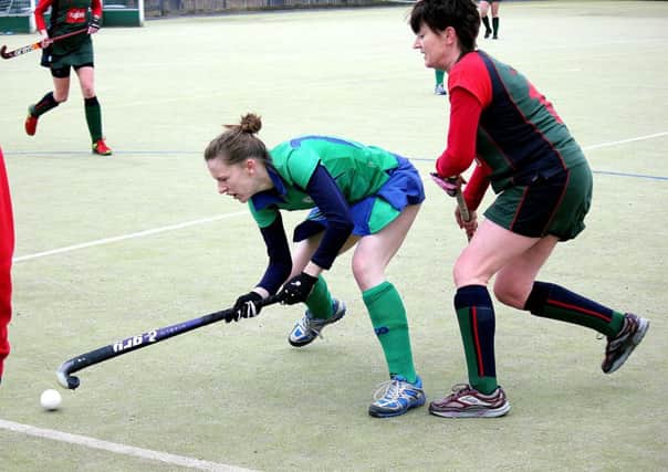 Protecting the ball at Ballymena Showgrounds was this Ballymena ladies 1sts player. INBT 08-859H