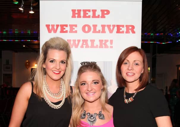 Carla Clyde and Cathie Alcorn (event organisers) pictured with Charlene Dickey (Oliver's mum) at the fashion show held in Coleraine Social Club on  to raise funds for wee Oliver Dickey. INCR09-144PL