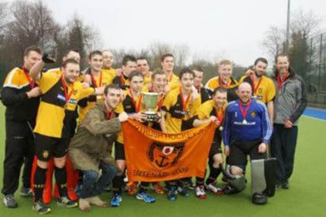 Portrush celebrate their Sussex Cup win earlier this year.