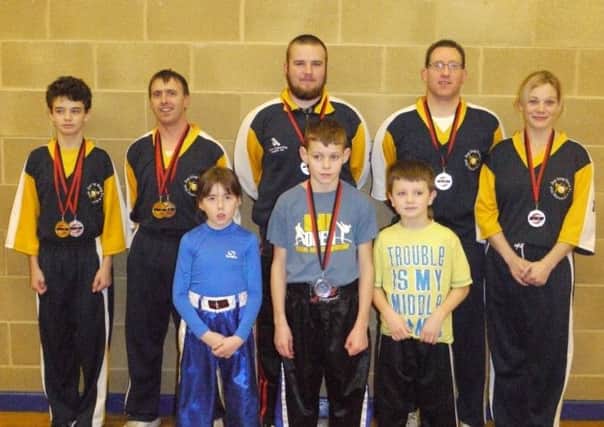 Jan Ling Freestyle Kung Fu & Kickboxing Club members who competed for WKU titles. Back L-R Ryan Sharpe, Mervyn Carson, Grizz Gillen, Ernie Johnston & Lisa Millar. Front L-R Josie Carson, Curtis Donnell & Jacob Sharpe.