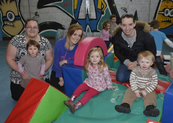 This group, from left, Lorraine McDaid, Willow McDaid, Suzanne Campbell, Katie Campbell, Sonia Ratcliffe and Jude Ratcliffe enjoy the facilities at the Caw Parent & Toddler Group in the Caw Youth Centre. INLS0814-199KM