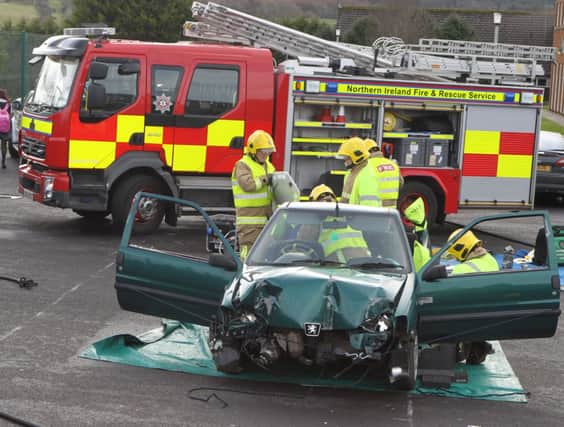 The scene at Cross and passion College where the Police and NIFRS provided a simulated car as part of a PCSP meeting for pupils from the school and Ballycastle High School.INBM09-14 122F