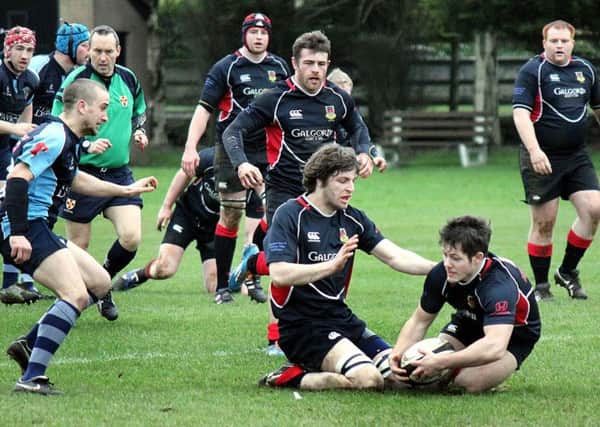 Two Ballymena Second XV players grapple for a loose ball during Saturday's Towns' Cup win over Ballymoney. INBT 08-850H