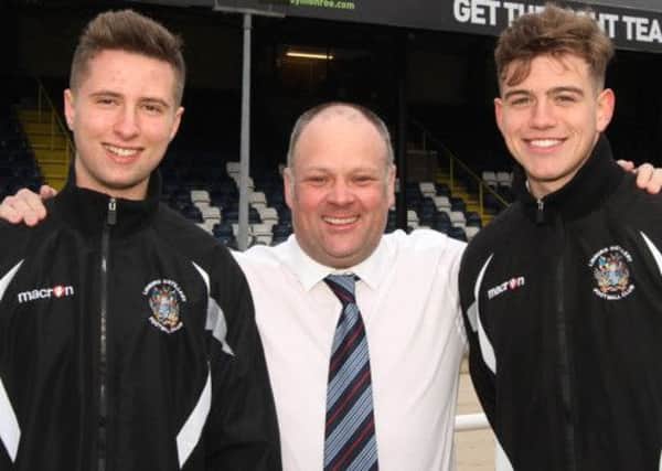 Pictured last Saturday before their trial this week at Dundee United are Lisburn Distillery Academy players Reece Kane (left) and Daniel Wilson (right) alongside Academy Director Andy Harwood. Picture- David Hunter.