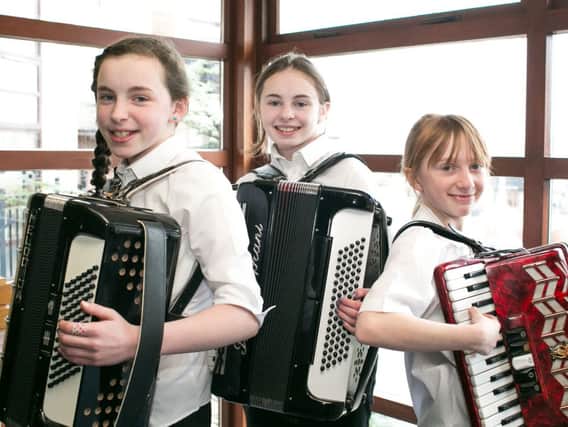 East Antrim Juniors Hannah and Lauren Blackburn pictured with Abigail Park who were taking part in the Accordion Band Championships in Carrickfergus. INCT 09-414-RM