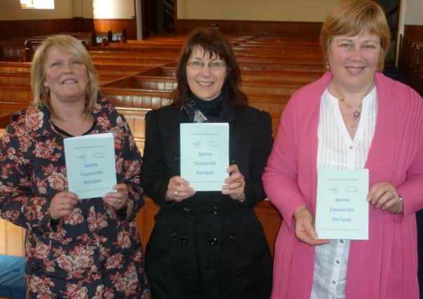Noelle Holmes, Gwen Smyth and Patricia Jones with the recently launched recipe book 'Some Favourite Recipes'. Members of Doneman Presbyterian Church are using the recipe book to raise funds for Mtunthama CCAP, Malawi.