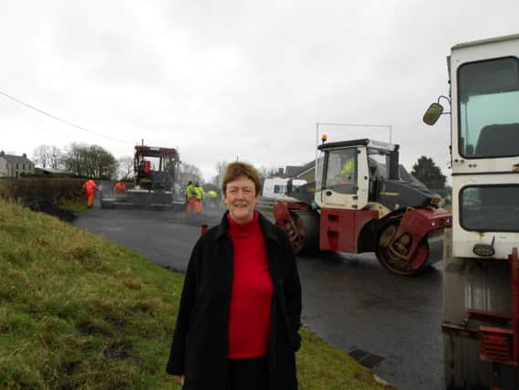 Councillor Joan Baird has welcomed the Roads Service work to improve the surface of the Ballinlea Road. INBM10-14