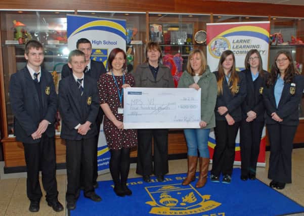 Students from Larne High School hand over a cheque for £400 to Alison Wilson from the MPS Society, Jacquie Seymour from Larne Skills Development and Gail Hughes, whose son Junathan suffers from MPS and is a former student of Larne High School. The money was raised by holding a non-uniform day at the school. INLT 10-001-PSB