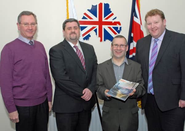 Local historian Dr David Hume (seconnd right) is pictured with Brian Blair, Jonathan Mattison and Jonathan Stevenson from the Grand Lodge Education Committee at the launch of David`s latest book, Union Cruiser: Ulster and the Gunrunning of 1914,,in Magheramorne old Orange Hall. INLT 10-011-PSB