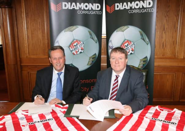 Mr Paul Diamond, Managing Director, Diamond Corrugated, Pennyburn Industrial Estate, signs a two year sponsorship extension with Derry City FC. On right is Mr Philip O'Doherty, chairman, Derry City FC.