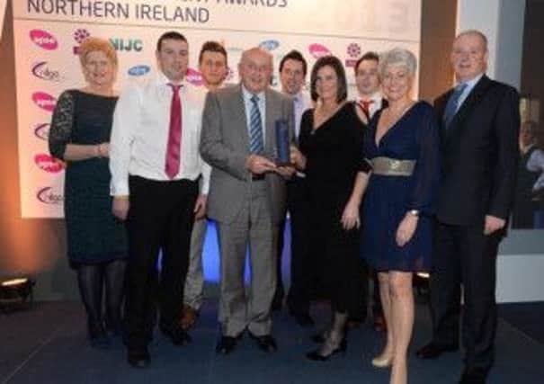 Dromore Community Centre  Manager Liz Doak and her staff team pick up their first-place award in the 'Best Local Authority Service Team of the Year' category of the NILGA awards.