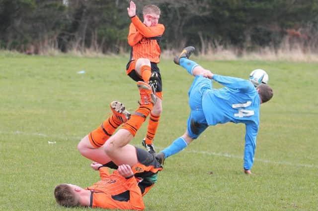 Action from West Bann Athletic's win over Finn McCool's.