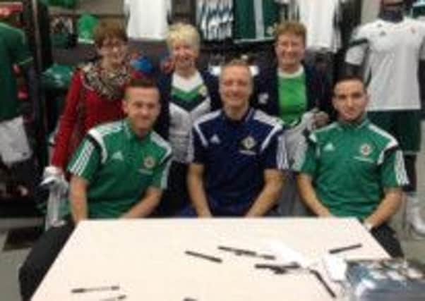 The club's very own Golden Girls - namely Norah Hamil, Sharon Gallagher and June Parke - with players Sammy Clingan, Maik Taylor and Martin Patterson during the recent launch of Northern Ireland's new away jersey.