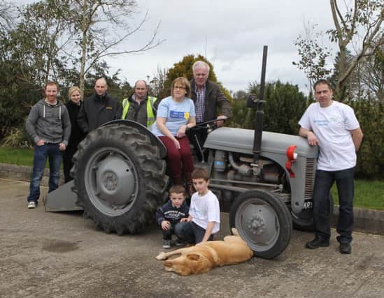 The McCormick family who are donating a tractor for the auction  at 11am on Sat 3rd May 2014 at Armoy Mart pictured with Malachy Butler from Marie Curie. Picture Kevin McAuley