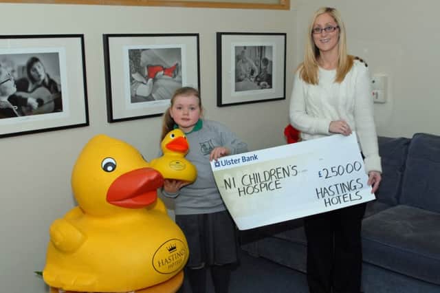Evie Dullaghan presents a cheque for £250 to Diane Weston, corporate fundraiser Northern Ireland Children's Hospice.. INNT 09-006-PSB