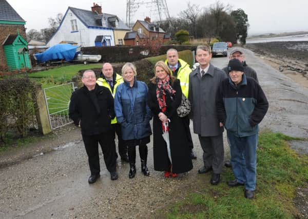 Minister Michelle O'Neill pictured visiting Culmore to view the flood defences. Included, are Councillors Tony Hasson, Sandra Duffy, Alderman Maurice Devenney, Kieran Mullan and Sean O'Neill, Rivers Agency  and residents, John Clarke and Matt Stewart. DER1214SL012