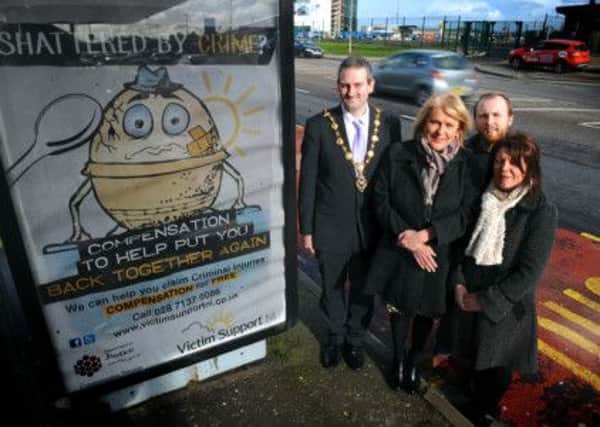 Mayor of Derry Martin Reilly pictured with Victim Support NIs Foyle Office Manager Oonagh Doherty), Neal Anderson and Marian Deane at the launch of their bus shelter advertising campaign promoting the charitys Criminal Injuries Compensation Services.