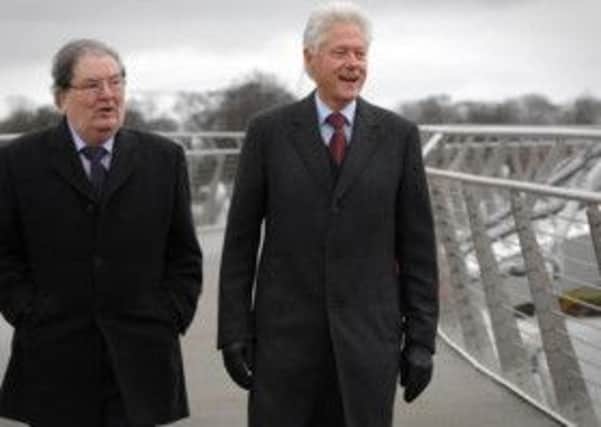 President Bill Clinton arrives in Derry, walking over the peace bridge with Nobel Laureate John Hume. (DER0914PG062) Photo Phil Gamble