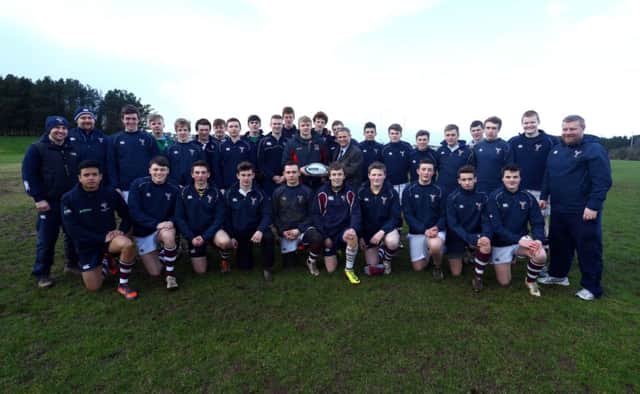 Ulster Rugby star Chris Cochrane and Tony Stevenson, Danske Bank, are pictured with the Coleraine AI 1st XV squad and coaches ahead of their Danske Bank Schools' Cup semi final against Sullivan Upper on Thursday.