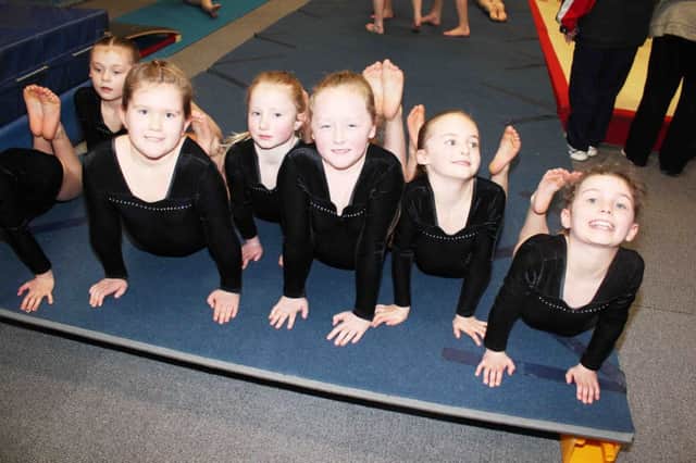 Doing their stretches before Sika Gymnastics Club's Northern Ireland two piece competition.