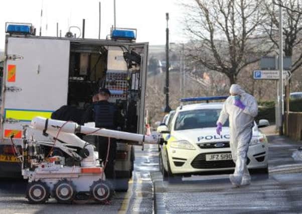 Friday 7 March 2014 - Army bomb disposal officers examine a 'viable' device found at the Royal Mail sorting office at Linenhall Street, Lisburn. It is understood the device, along with another discovered earlier at Royal Mail offices in Londonderry, was in a package addressed to Maghaberry Prison. Picture: Cliff Donaldson