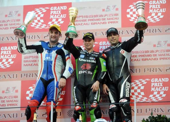 Third placed Jeremy Toye on the 2010 Macau Grand Prix rostrum with  winner Stuart Easton and runner up Michael Rutter. Toye may be joining Easton and Rutter at Portrush in May.
PICTURE BY STEPHEN DAVISON