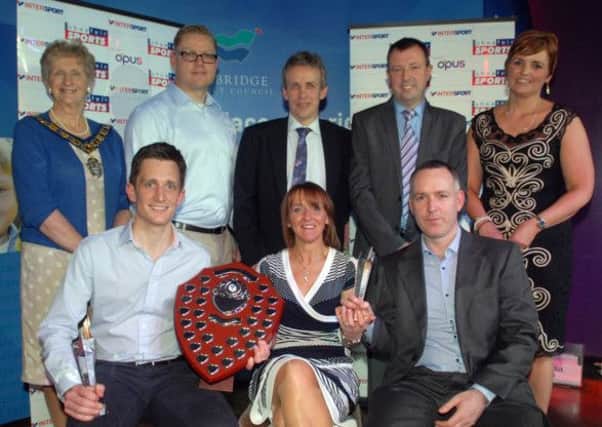 Banbridge Hockey Club were well represented in the prizes at the Banbridge District Sports Awards. Colin Dowds collected the Senior Team of the Year Award while Mark Tumilty was named Coach of the Year. Included are Yvonne Jackson, Shoefair, Council chairman Olive Mercer, Tom Court, special guest, Michael Watt, Sports Association chairman, Cllr Ian Burns, and compere for the evening, Denise Watson.  INBL1014-SPORTSAWARDS7