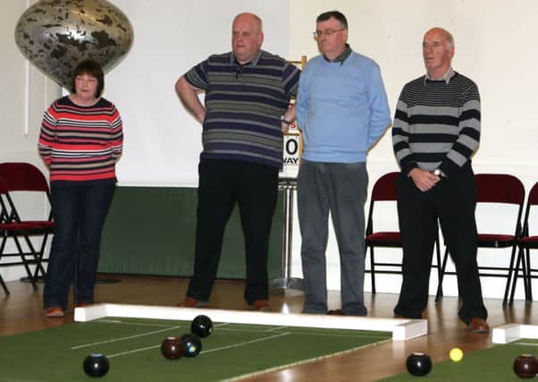 Members of Maine and All Saints Bowling Clubs keep a close eye on the state of play during their match. INBT11-215AC