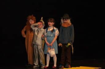 Some of the children on stage during their play.
