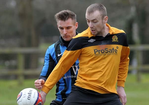 Barn's Andy Kane shields the ball from UUJ's Ferghal Brannigan. Photo: Philip McCloy