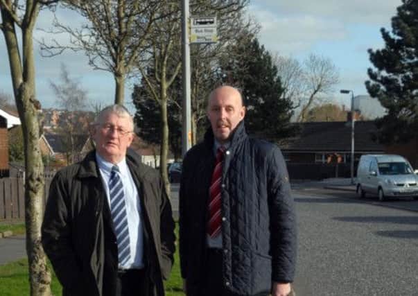 Sydney Anderson MLA with Councillor Junior McCrum at the muddy Edenderry bus stop.