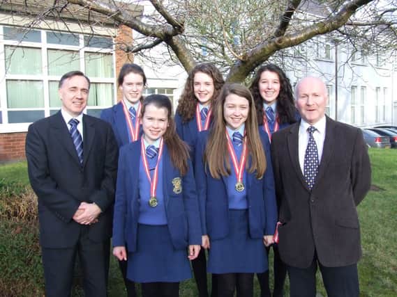 Members of the Loreto College Junior Girls Cross Country Team with their Ulster medals, ahead of their All Ireland title-winning success, L-R Mr Michael James (College Principal), Emma McLaughlin, Anna Morrison, Molly Brennan, Abigail McBroom, Victoria Tsang, Mr Paul Cunning (Cross Country Coach).