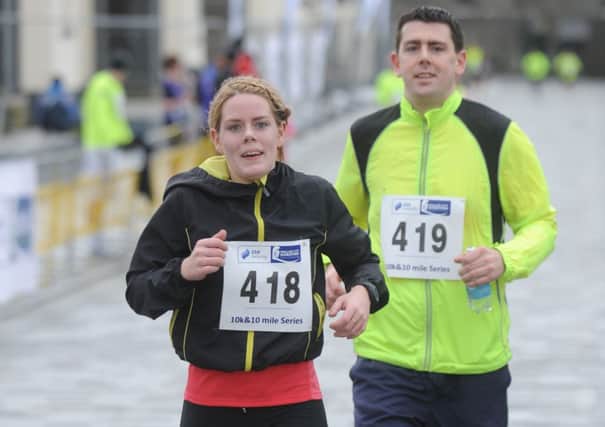 Brother and sister, Declan and Nuala Gill cross the finish line at the SSE Airtricity 10K at Ebrington on Sunday.