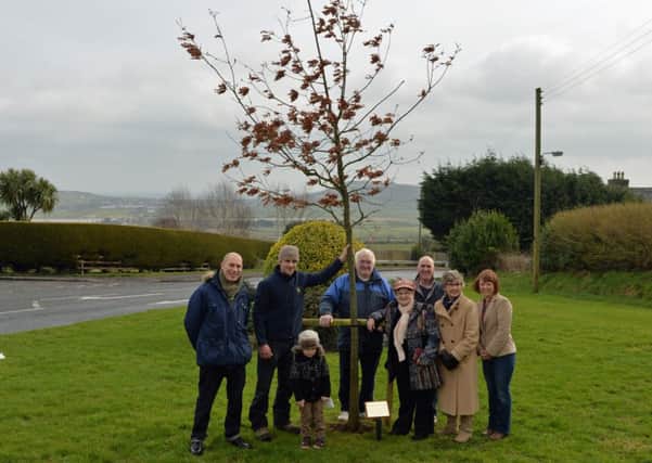Stephen McGowan (2nd left) donated an oak tree to members of the Ballycarry Community Association is pictured with members and chairperson,Valerie Beattie. INLT 11-076-PSB