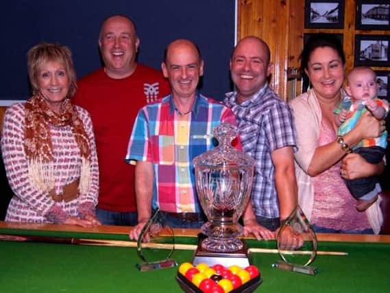 Pictured at the Dessie Logue Memorial Pool competition held in the Roost Bar Coleraine  is the winner John Cosgrove (2nd right) and runner up Uel Boreland (2nd left) with members of the Logue family, Valrie ( who presented the Trophy)  Julian, son, wife .