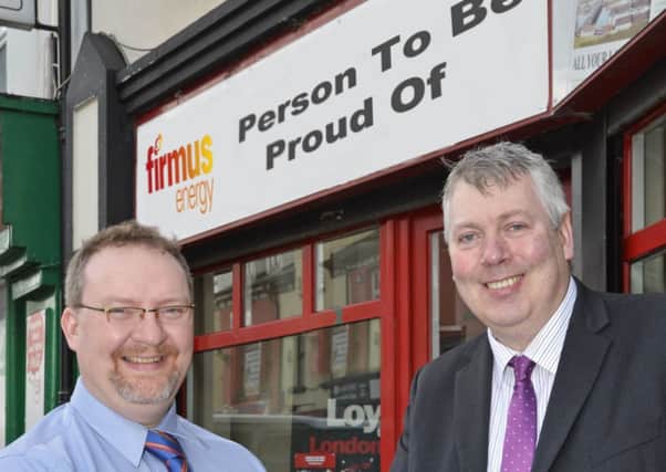 William Allen, right, Group Editor, pictured with Gavin Twamley, Domestic Sales Representative for Firmus Energy. INLS0814-166K