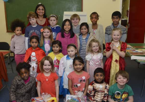 Sumeeta Gupta, organiser, pictured with children who enjoyed the Bookmark competition held in the Kumon Centre as part of World Book Day. INLS1014-181KM